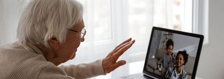 elderly woman on a video call with her grandchildren