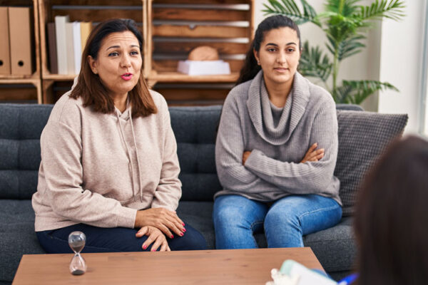 Three woman mother and daughter having therapy session