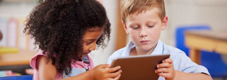 Classroom, tablet and children learning together, studying and education in school