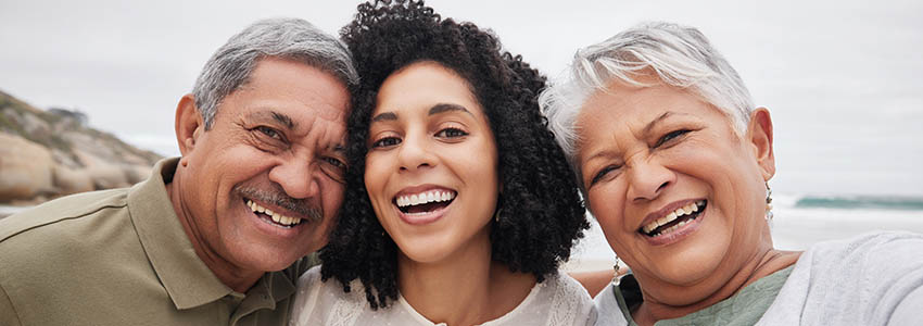 woman and senior parents at beach on holiday, vacation or travel outdoor.