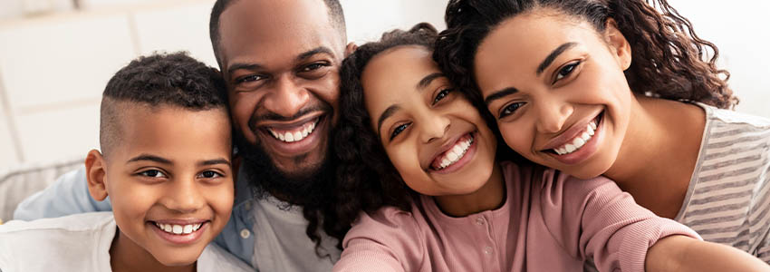 Portrait of family taking a selfie together at home