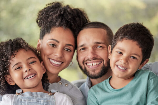 Happiness, mother and father smiling with young Latino kids