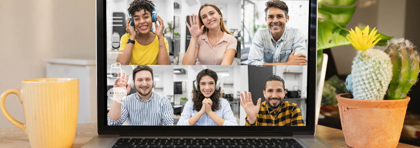 desk with laptop using online video chat service at workplace