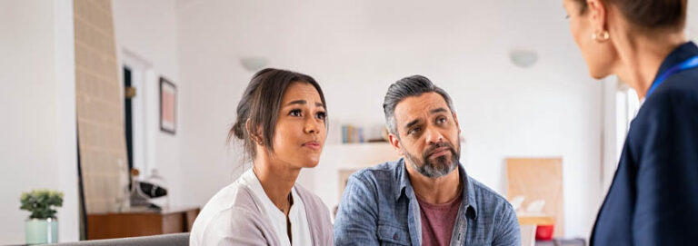 Worried couple meeting therapist