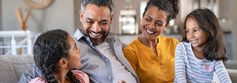 Happy blended family sitting together