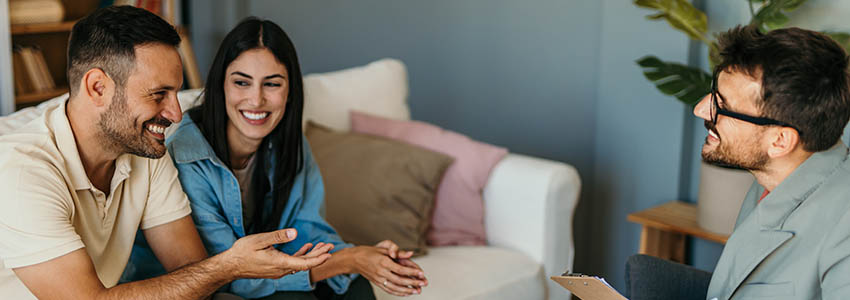 Young couple talking to psychologist