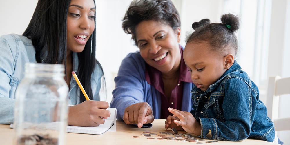 Mother, grandmother, and child counting coins